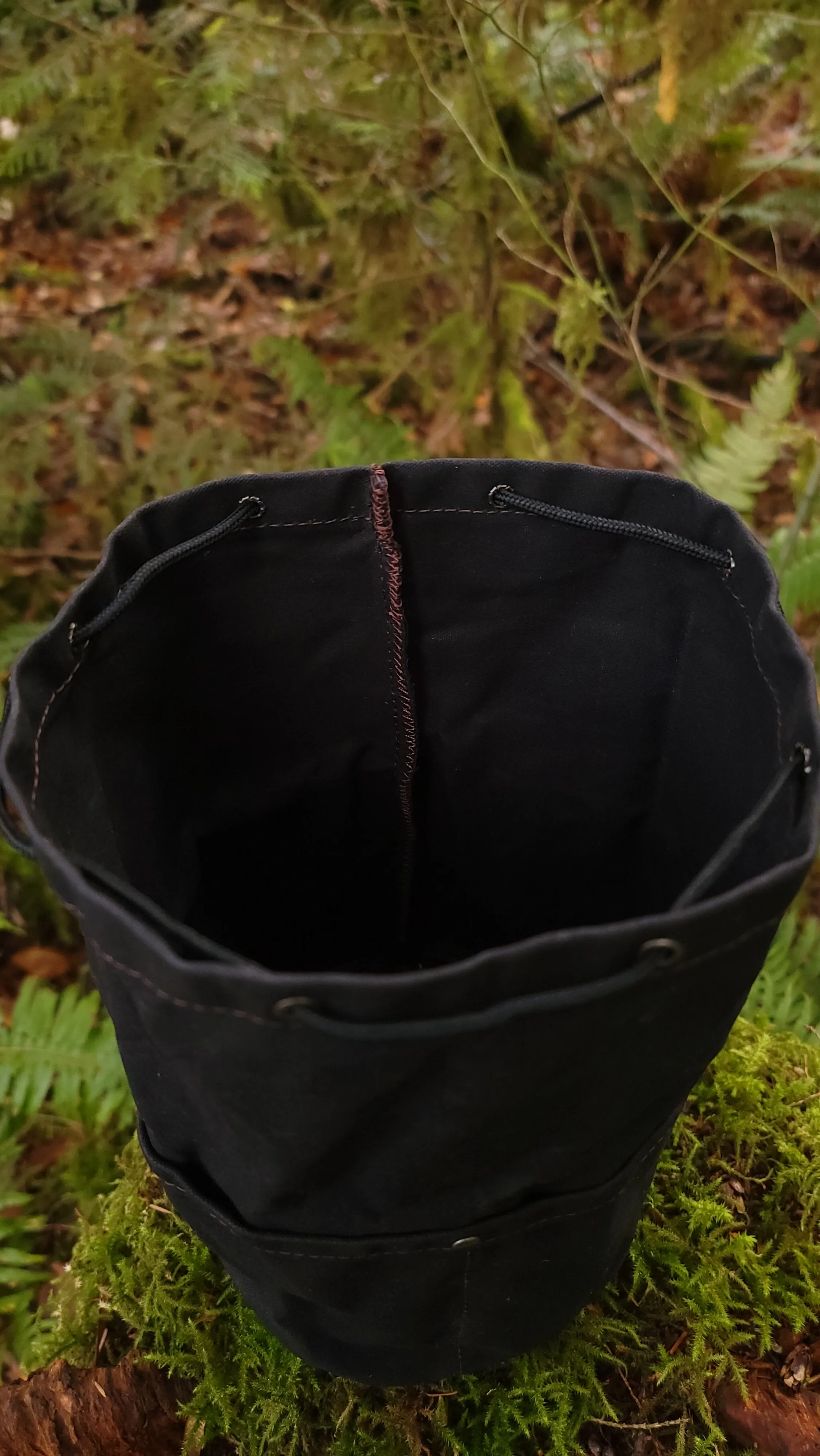 Black Waxed Canvas Cedar Bucket Bag with Outside Pockets.